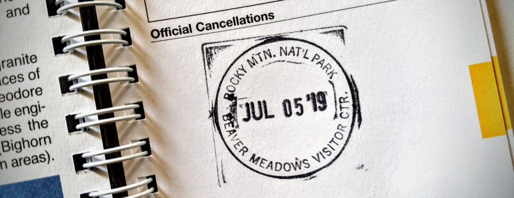 Rocky Mountain National Park rubber stamp cancellation in National Parks passport book.