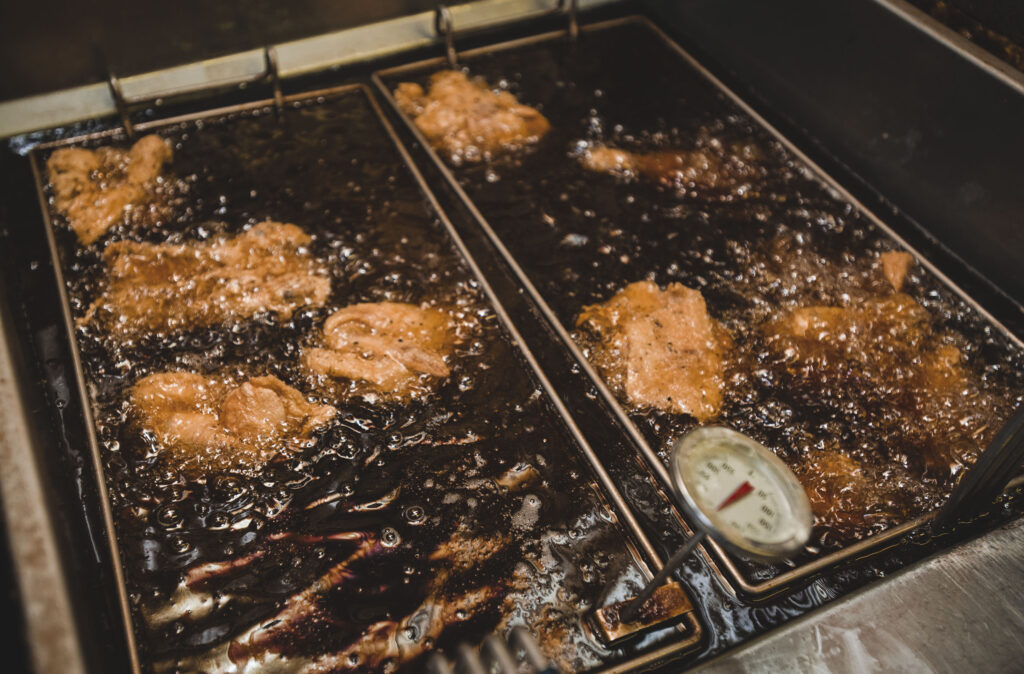 Chicken pieces sizzle in a deep fryer at Stone's Family Restaurant.