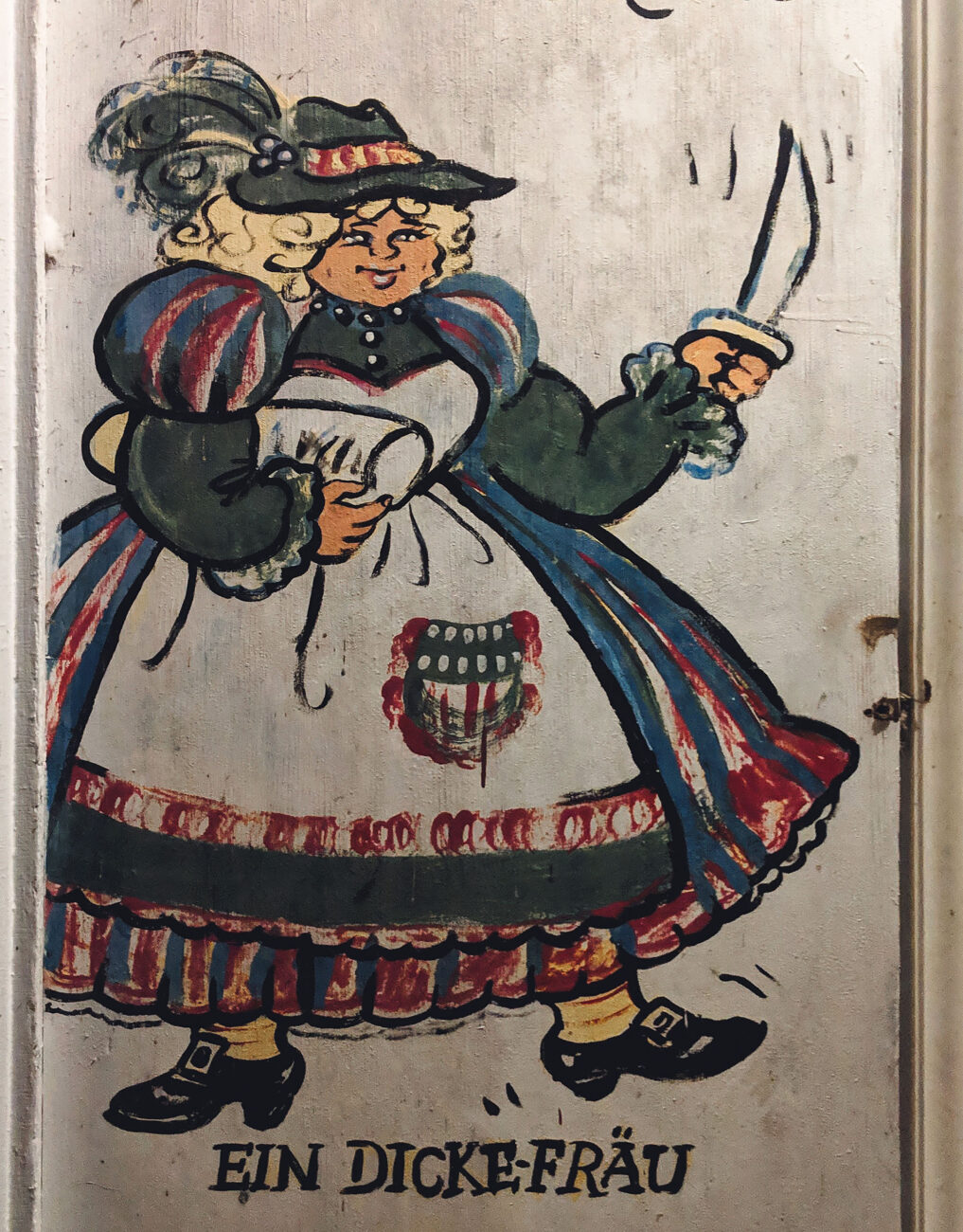 Painting of "ein dicke Frau," or thick wife outside the Brau Haus in Oldenburg, Indiana.
